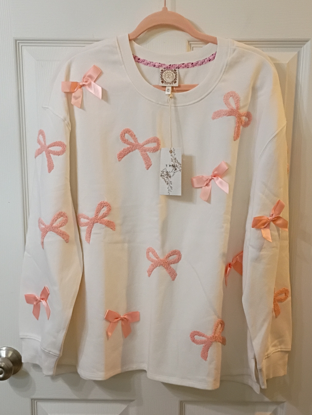 TS Cream Sweatshirt with Pink Bow Embellishments